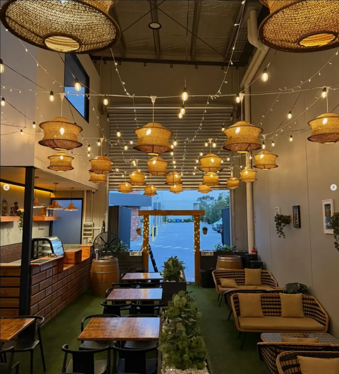 Warm rattan lights and aesthetic seating inside Laphing Central